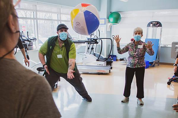 Participants work as a group to keep a beach ball off the ground